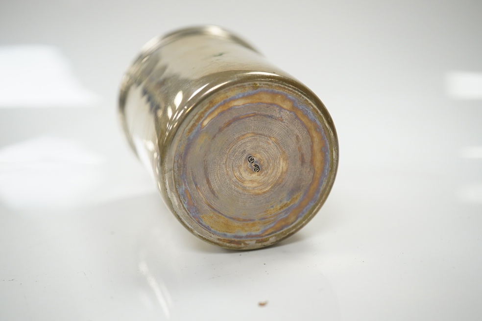 An Austrian 800 standard white metal matchbox holder, a 19th century continental white metal beaker, a modern silver mounted box cover and a silver vesta case. Condition - poor to fair